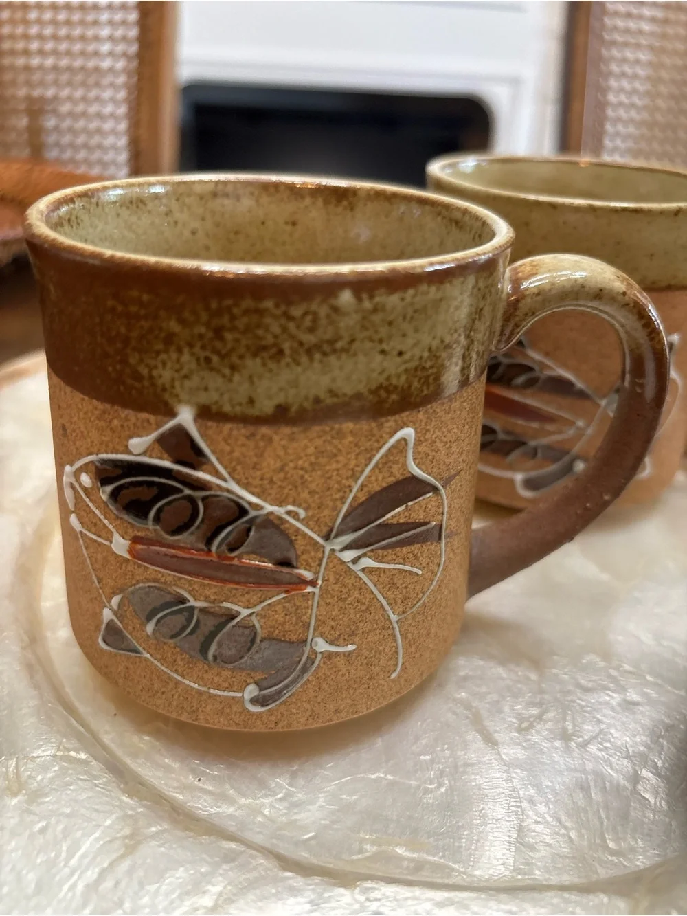 Three vintage stoneware pottery mugs with hand painted fish